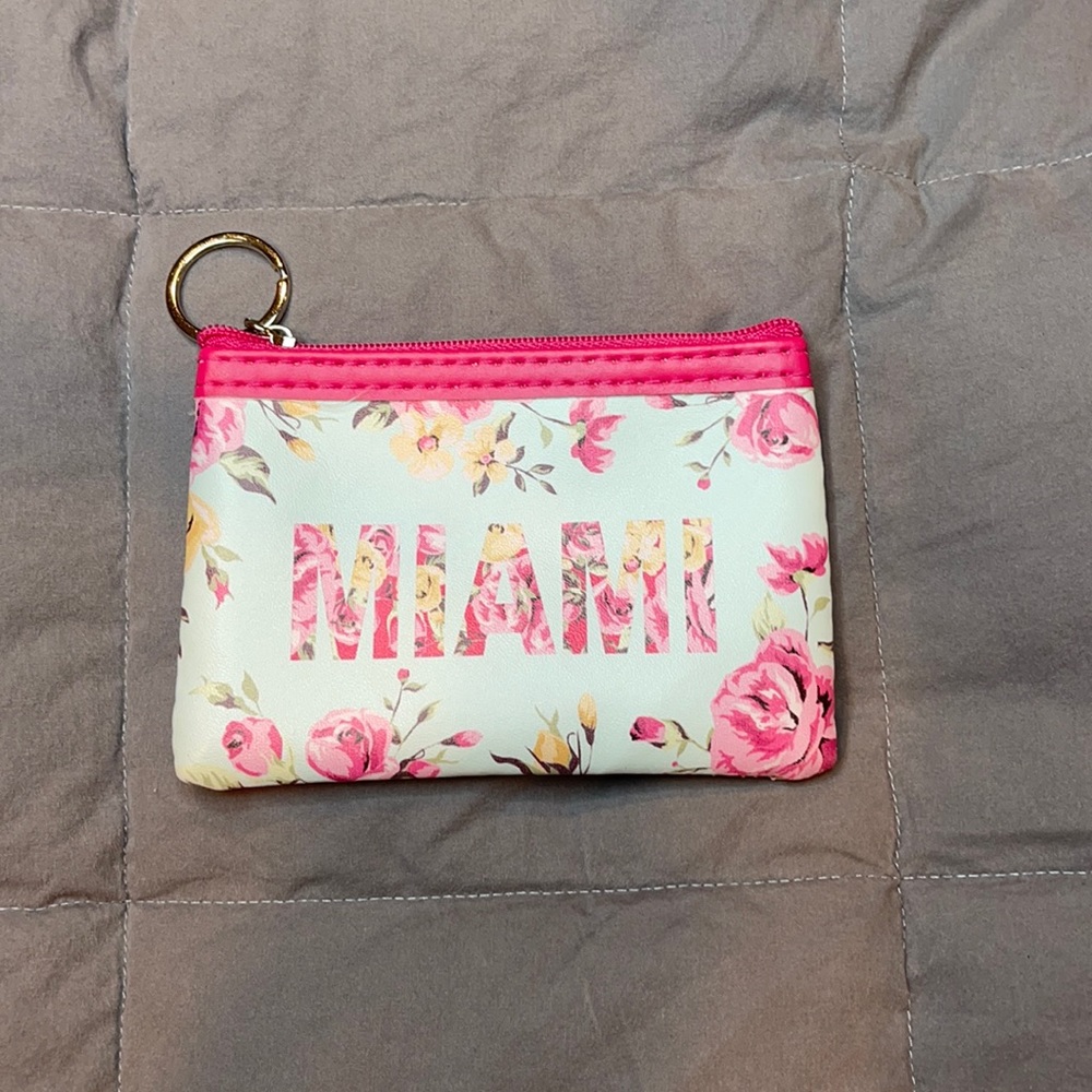 Floral Miami coin purse with pink zipper. New. Never used.